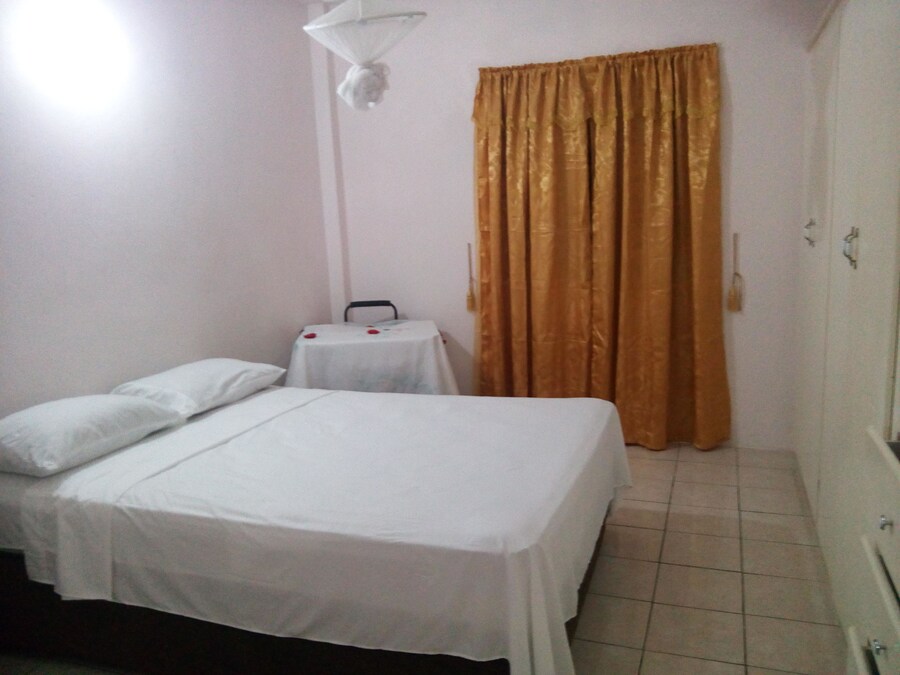 Bedroom in the one-bedroom apartment, shown on Expedia
